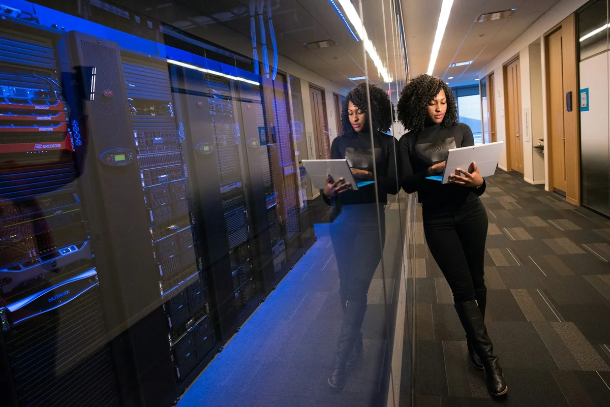 Technical specialists inspecting equipment in a server room
