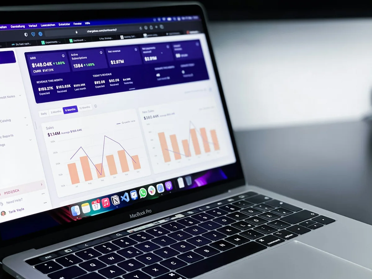 Search and website performance reports displayed on a laptop